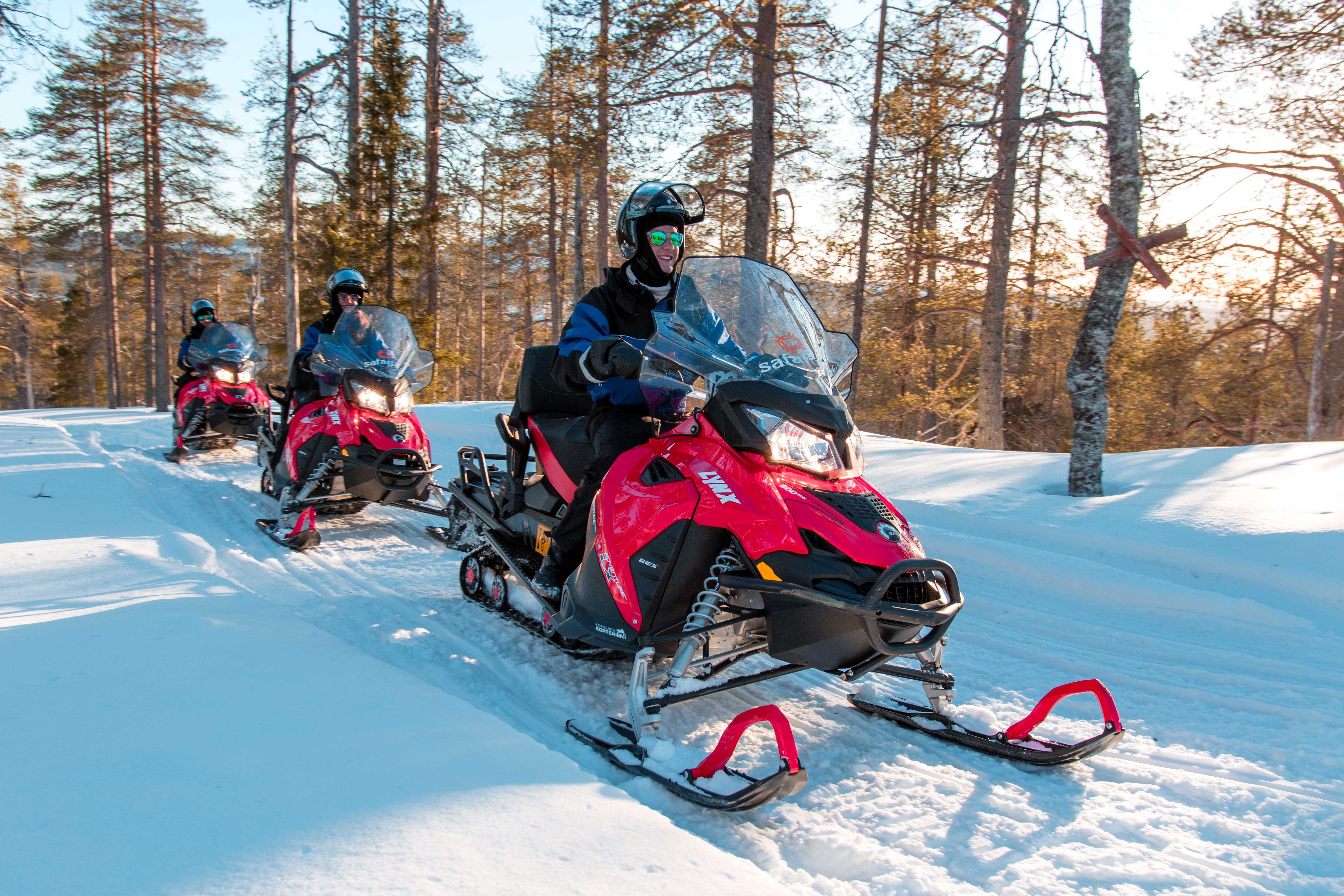 Snowmobile safari with ice fishing and outdoor lunch in Levi