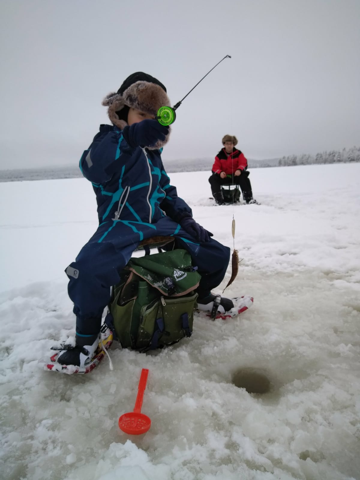 Ice fishing by snowshoes