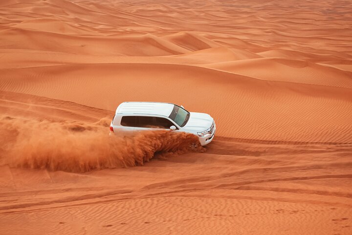 Dubai Desert Safari Dune Bashing, Camel Ride, Sand Boarding, BBQ Dinner.