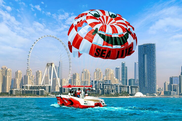 Parasailing in Dubai with Palm Jumeirah and JBR Beach views